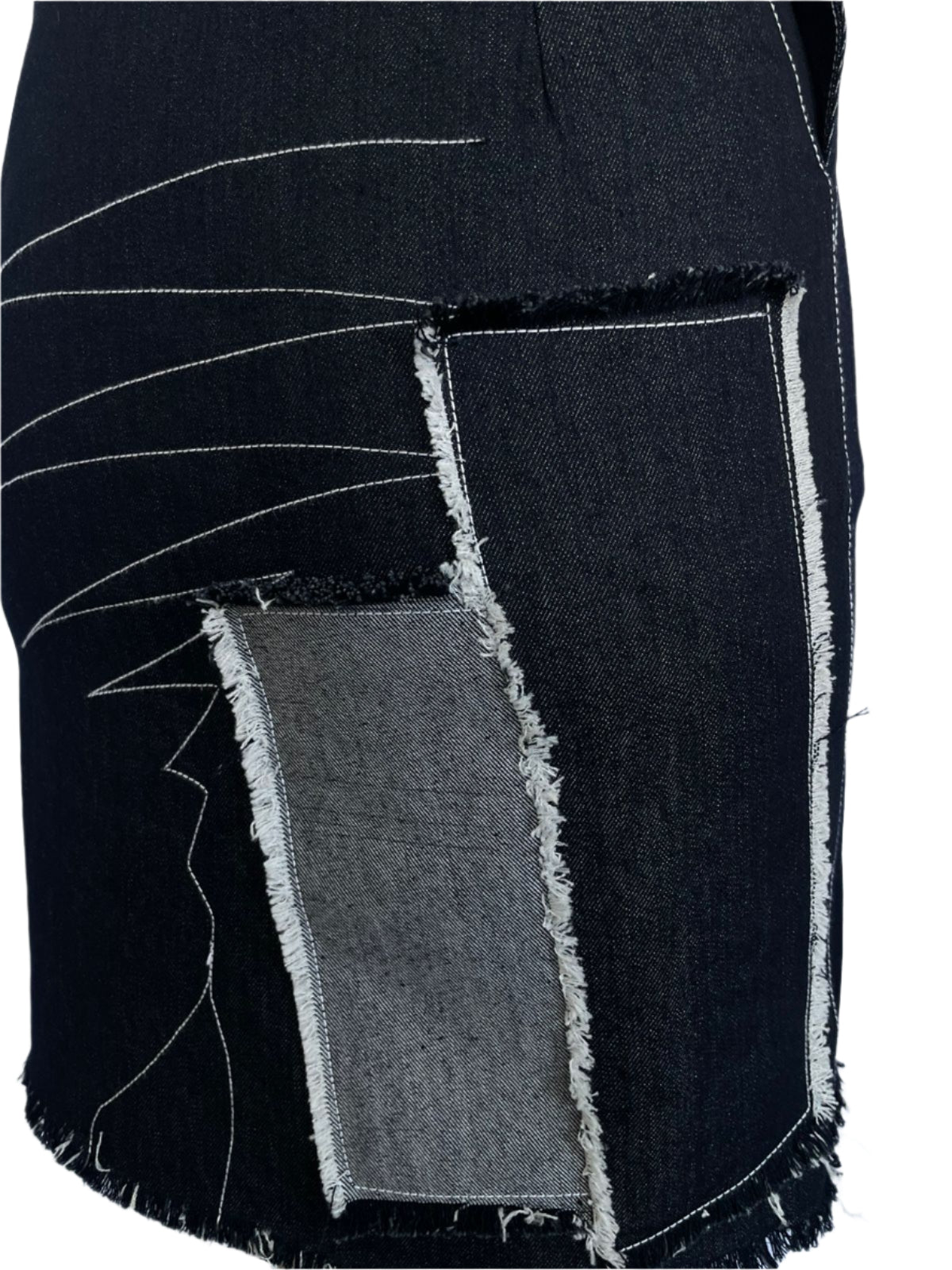 Black fabric with white stitching on a white background