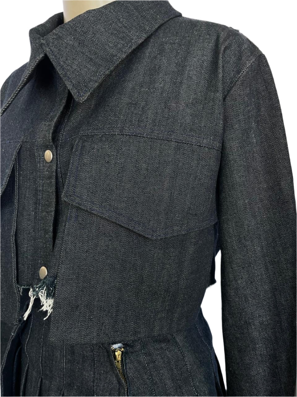 Blue denim jacket with a collar and front pocket on a mannequin against a white background